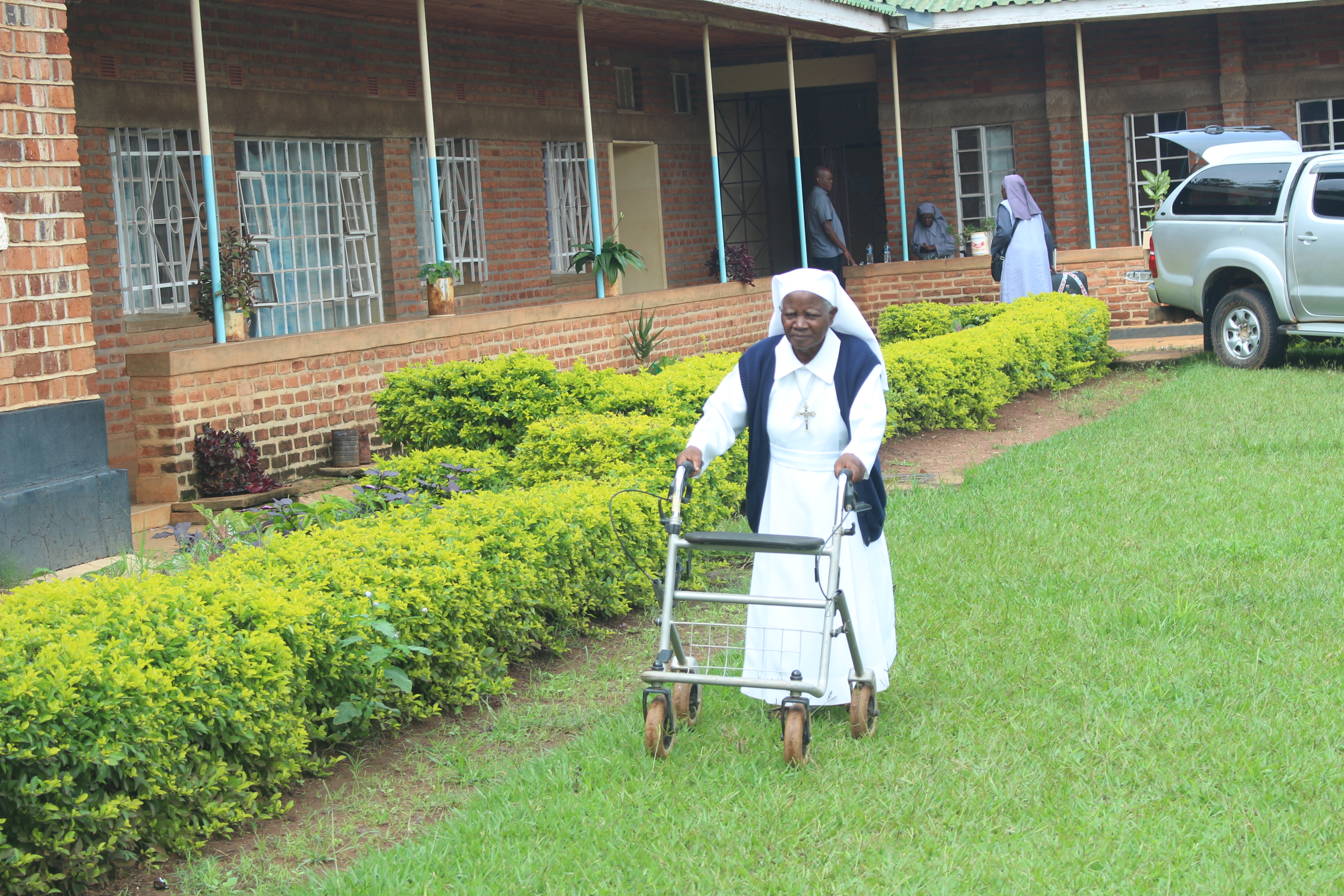 Supporting elderly sisters with some assistive devices.
